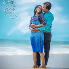 A classic beach "Save the Date" photo. The clear blue sky and ocean provide a perfect, serene backdrop for announcing your wedding date.