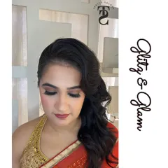 This is an example of my subtle party makeup. The look features soft, shimmery eyeshadow, defined lashes, and a neutral lip color, creating an elegant and glamorous effect that is not overpowering.