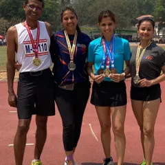 Coach Brinston with his medal-winning athletes. He has a proven track record of developing champions.
