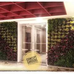 This is an example of how natural vertical gardens can transform a corporate entrance. We flanked this doorway with two floor-to-ceiling living walls, using a rich palette of red and green plants to create a dramatic and welcoming atmosphere.