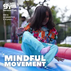 A preschooler enjoys sliding down a soft ramp. My gym is filled with age-appropriate equipment that allows kids to explore movement and build confidence in a playful way.