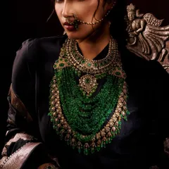 For this portrait, the goal was to create a regal and powerful mood. The dramatic, low-key lighting makes the stunning green beaded necklace the undeniable hero of the image.