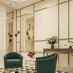 This seating nook demonstrates how to create intimate moments within a larger space. The use of bold, emerald green chairs against a backdrop of geometric patterns and reflective surfaces adds a touch of personality and curated style to the home.