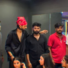 A candid moment of our instructor giving feedback after a video shoot with the Bollywood class.