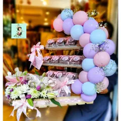 We were so excited to create this special hamper to celebrate the arrival of twins for the Ambani-Piramal family. This arrangement features a beautiful balloon cluster in pastel pink, blue, and purple, paired with a fresh floral display of lilies and chrysanthemums. A tiered stand of delicious brownies adds a sweet touch to this grand welcome gift.