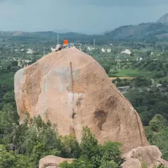 Faith and climbing intersect at Gaali Kallu. Local villagers believe a rock formation on the spire is a statue of the bull-god Basava. We were honored to help them hoist a flag to the top, a strange and invigorating experience.
