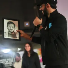 Aman Gupta from Shark Tank India holding the portrait I sketched for him during the event at IIT Delhi.