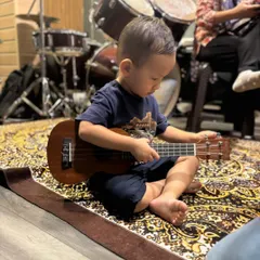Our youngest rockstar in the making. This little one is getting an early start, exploring the feel and sound of a ukulele in our studio. We believe in making music accessible and fun for all ages.