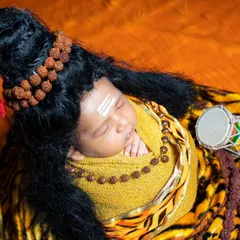 Another peaceful shot of our little Shiva, capturing the divine innocence of a newborn.