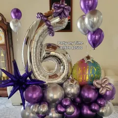 A 6th birthday balloon bouquet in purple and silver, with a star-shaped foil balloon.