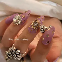 This view highlights the different charms and embellishments used in this Navratri set, including the dangling jhumka and the sparkling star-shaped crystals.