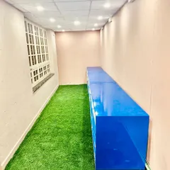 This long room was fitted with our artificial turf to create a unique indoor recreational or display area. The green floor contrasts sharply with the plain walls, making a bold statement.