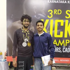I'm incredibly proud of my students. Here is one of our fighters after winning medals at the 3rd State Level Kickboxing Championship. We don't just train, we build champions.