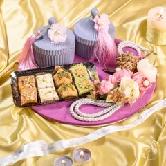 My festive hampers are designed to capture the spirit of celebration. This Diwali platter combines traditional Indian sweets like baklava and barfi with elegant, reusable jars and floral arrangements, making it a perfect centerpiece and gift.