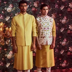 We offer classic silhouettes in the traditional 'peela' color, perfect for Haldi ceremonies. Choose from pintucked jackets or embroidered Nehru jackets.
