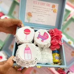 Inside our naming ceremony trunk boxes, guests will find sweet, baby-themed treats and a small bottle of bubbles, all beautifully presented.