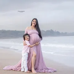 The bond between a mother and her child begins long before they meet. This beach maternity photo, with her son hugging the baby bump, is just pure love.