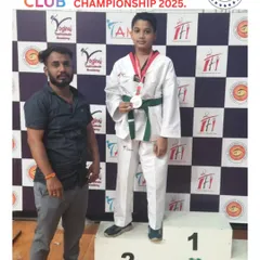 We celebrate Hamdan Ansari on the podium with his silver medal in Kyorugi at the 5th Maharashtra State Open Taekwondo Championship. His performance was a testament to his hard work.