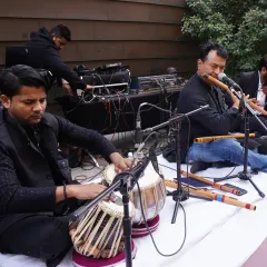 A classical music ensemble playing the tabla and flute, adding a touch of traditional elegance and serene music to the wedding ceremony.