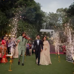 A grand entrance for the couple at their reception, complete with a live violinist and sparkling cold pyrotechnics. It’s these special touches that create truly magical and memorable moments.