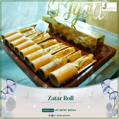 Our signature Zatar Rolls, uniquely presented in bamboo holders on a wooden tray, offer a delightful blend of Middle Eastern flavors and creative presentation.
