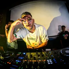 An artist's view from the DJ console. This fisheye shot captures the intensity and focus I bring to my live sets, connecting with the audience through music.