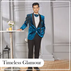 Timeless glamour. A full-length shot of the electric blue velvet tuxedo, perfect for a black-tie event or a grand reception where you want to stand out.