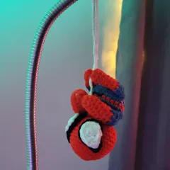 This little crochet Spiderman charm is perfect for hanging in your car or on a bag. It's a small and fun way to show off your favorite hero.