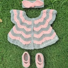 This is one of my favorite creations, a complete baby frock set in soft pink and grey. It includes a chevron-patterned dress, matching little booties, and a sweet bow headband. It’s a perfect, heartfelt gift for a baby shower or a newborn's first outfit.
