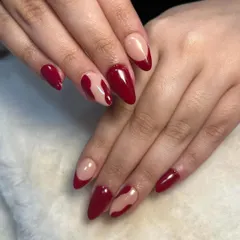 A full view of the abstract red nails. This level of execution demonstrates the effectiveness of hands-on training and personal guidance.