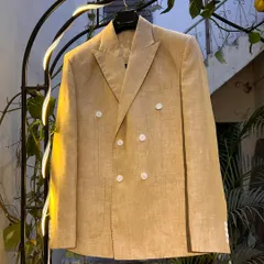 This double-breasted linen blazer is a versatile summer staple. Unlined and lightweight, it can be dressed up or down while keeping you cool and stylish.