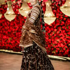 This beautiful client is giving off royal vibes in her brown velvet outfit. I created a glamorous look with defined eyes and a braided hairstyle to match her regal attire.
