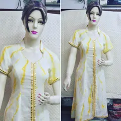 Perfect for summer events, this white and yellow tie-dye cotton kurta is both simple and stylish. I added a line of mirror work along the front placket and sleeve cuffs to give this casual piece a touch of festive sparkle.