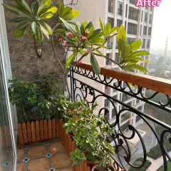 Even a small balcony can become a charming nook. We used warm wooden planters to add structure and character, turning this cozy corner into a space full of life.