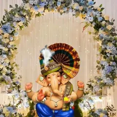 An elegant Ganpati setup with a beautiful floral arch of blue and white hydrangeas, creating a serene and heavenly atmosphere.