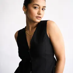 The same sleek ponytail and natural makeup, showing how it creates a polished and professional look suitable for any portfolio.