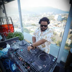 A clear shot of my professional Pioneer DJ setup against the backdrop of the city. I bring my own high-quality equipment to every event to guarantee the best sound.
