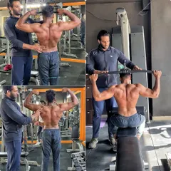 Here I am guiding a client through his back poses, checking for symmetry and definition. We work together to perfect every detail.