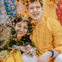 The Haldi ceremony is pure, unadulterated joy. It’s a celebration painted in the brightest yellow, filled with laughter and the blessings of loved ones. I love capturing the playful chaos, like this shower of marigold petals, where smiles are brighter than the sun. These are the moments of pure 'masti' that become cherished memories.
