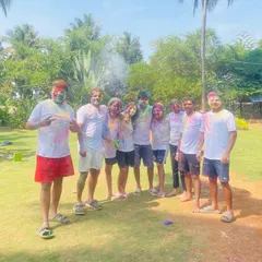 Happy Holi. A group of friends celebrates the festival of colors with us, covered in vibrant powders and big smiles.