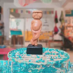 "No one is YOU & that is your Power." This quirky, hand-carved wooden figure stands proudly, a small reminder of the beauty of being unique.