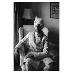 A timeless, window-lit portrait of the groom, Sid, in his wedding sherwani. This black and white shot has the feel of a classic painting.