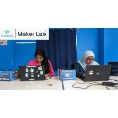 We believe in creating an inclusive environment where every student can thrive. Here, two of our students are focused on their coding tasks, demonstrating the concentration and dedication we see in our young innovators every day.