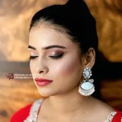 A close-up of the eye makeup, showing the soft brown and shimmer eyeshadow blend that adds depth and sophistication to this party look.