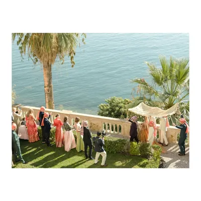 A bride's entrance overlooking the magnificent Lake Garda in Italy. This is what destination wedding dreams are made of, a perfect fusion of culture and breathtaking scenery.
