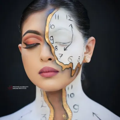 Embracing the magic of fantasy makeup. This surrealist clock-inspired look, with its melting design and intricate details, showcases the creative potential we unlock in our students.
