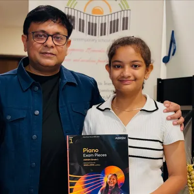 A proud moment for our student after completing her Grade 1 Piano Exam. We provide full support and materials for ABRSM exam preparation.