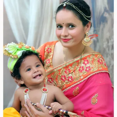 A mother and her little one dressed as Krishna for a Janmashtami photoshoot. I provide traditional attire and props to make these sessions authentic and special.