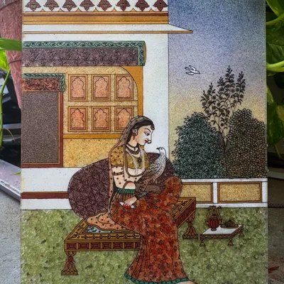 This painting of Bani Thani is a tribute to the timeless elegance of Rajasthani royalty. Inspired by the famous Kishangarh school of art, I use finely crushed gemstones to capture the grace and intricate details of her attire and the royal haveli setting. It is a piece of our heritage, designed to bring a sense of history and refinement to your space.
