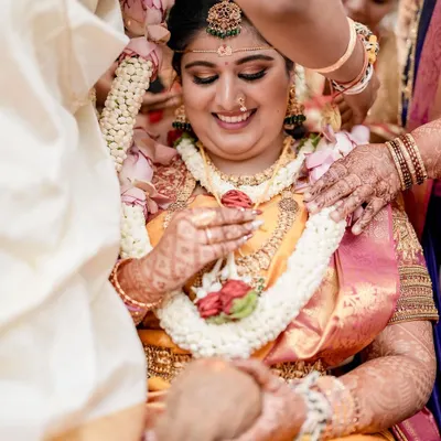 A beautiful candid moment of our bride Bhumi during her wedding ceremony. Her joyful smile captures the essence of a dream wedding coming to life, surrounded by the love of her family.